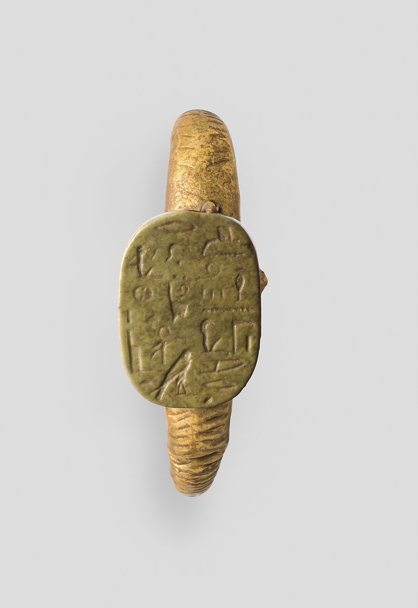 Roman period gold earring mounting an older Egyptian inscribed plaque, Metropolitan Museum of Art