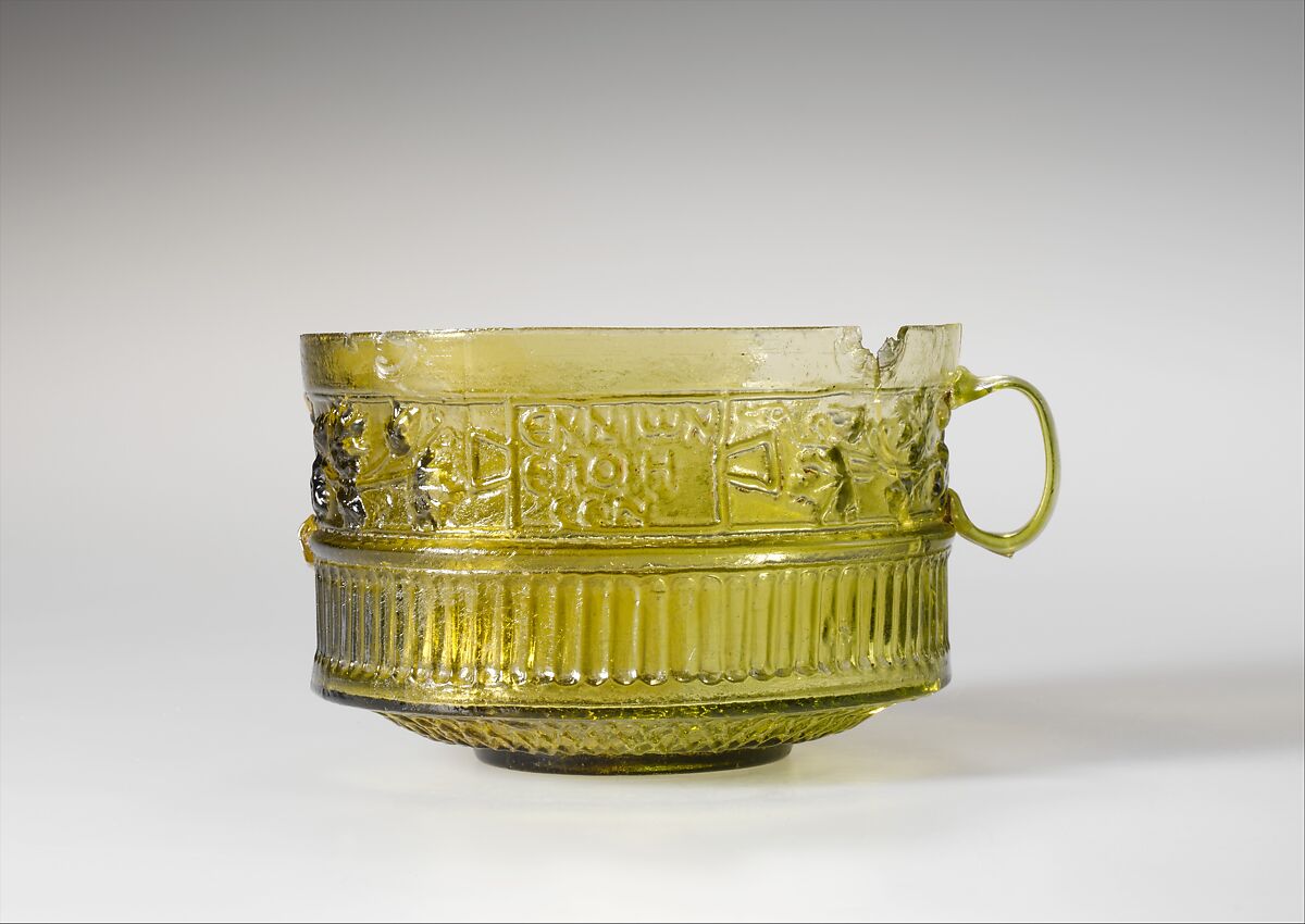 Yellow-green Roman mould-blown glass cup, first half of the first century A.D.